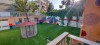 چمن مصنوعی حیاط مدرسه غیر انتفاعی امام رضا قزوین